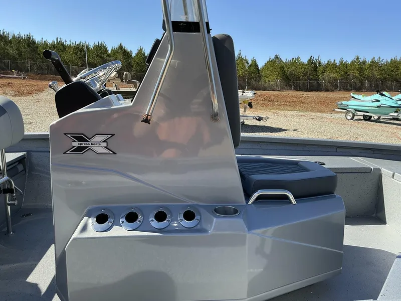 Slide: The Image of 2025 Xpress Hyper-Lift Series H20B boat console with seating, outdoors. - 3