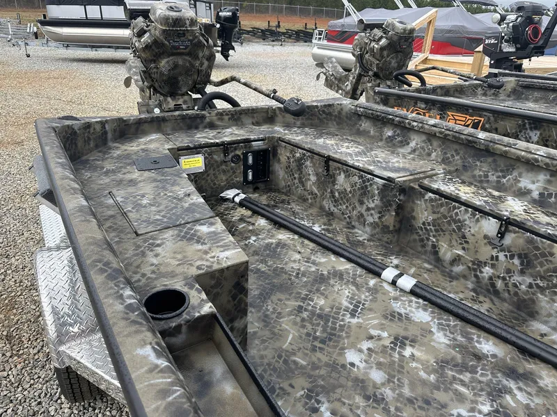 Slide: The Image of 2025 Excel Shallow Water F4 boat with camouflage design, featuring dual motors and rugged build. - 2