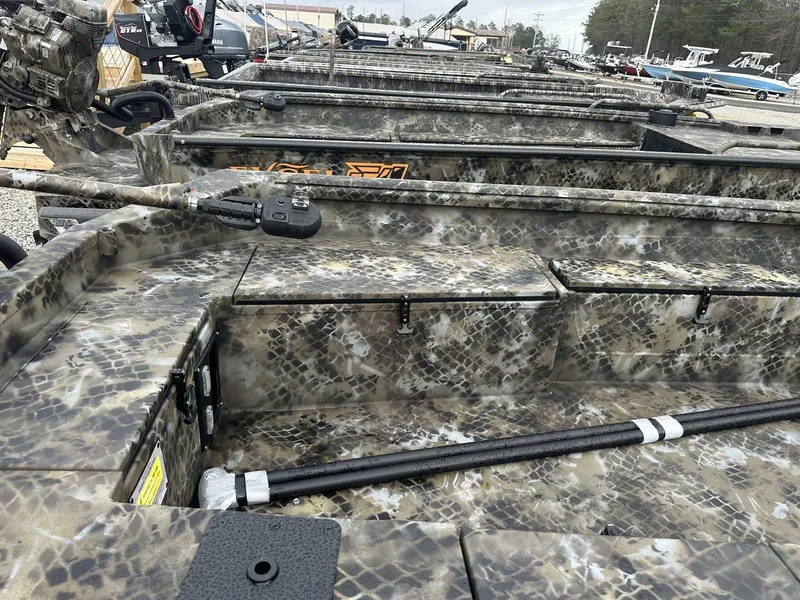 Slide: The Image of Camouflage-patterned Excel Shallow Water F4 1754 F86 HDR5000 boat, 2025 model, in a showroom. - 9