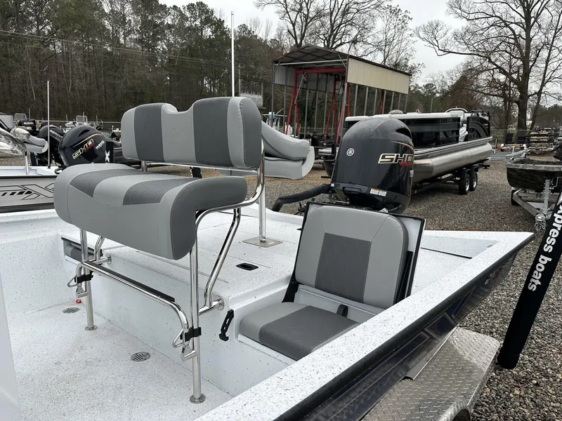 Slide: The Image of 2025 Xpress Hyper-Lift Series H22B boat with Yamaha engine, featuring gray seating. - 10