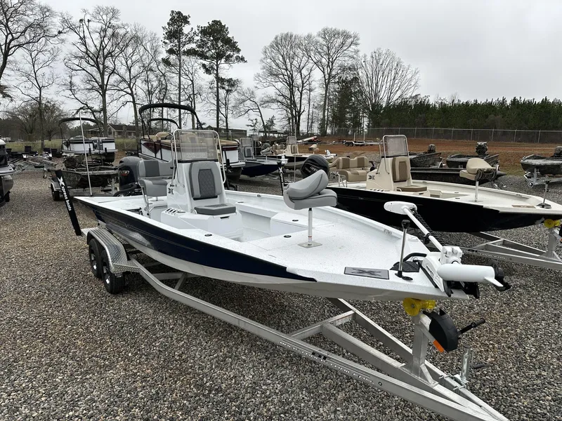 Slide: The Image of 2025 Xpress Hyper-Lift Series H22B boat on trailer, displayed outdoors. - 11