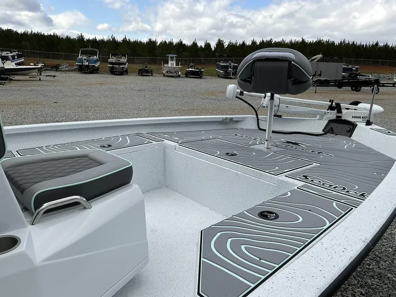 Slide: The Image of 2025 Xpress Hyper-Lift Series H20B boat with new console, featuring sleek design and seating. - 11