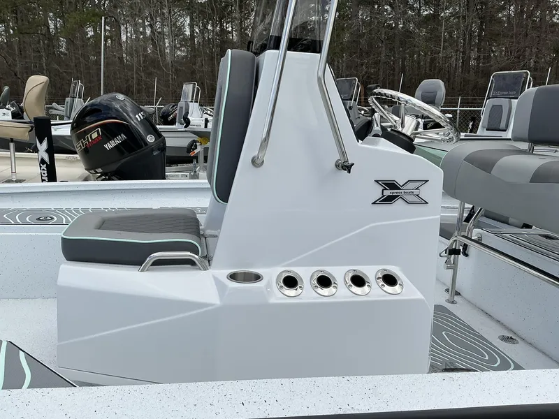 Slide: The Image of 2025 Xpress Hyper-Lift Series H20B boat console with seating and Yamaha engine. - 4