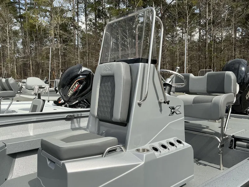 Slide: The Image of 2025 Xpress Hyper-Lift Series H22B boat with sleek console and seating. - 13