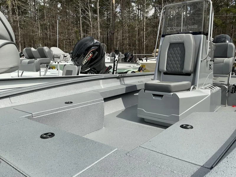 Slide: The Image of 2025 Xpress Hyper-Lift Series H22B boat with sleek seating and powerful outboard motor. - 4