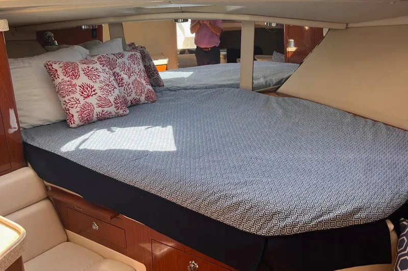 Slide: The Image of 2006 Regal 3360 Window Express cabin with bed and decorative pillows. - 12