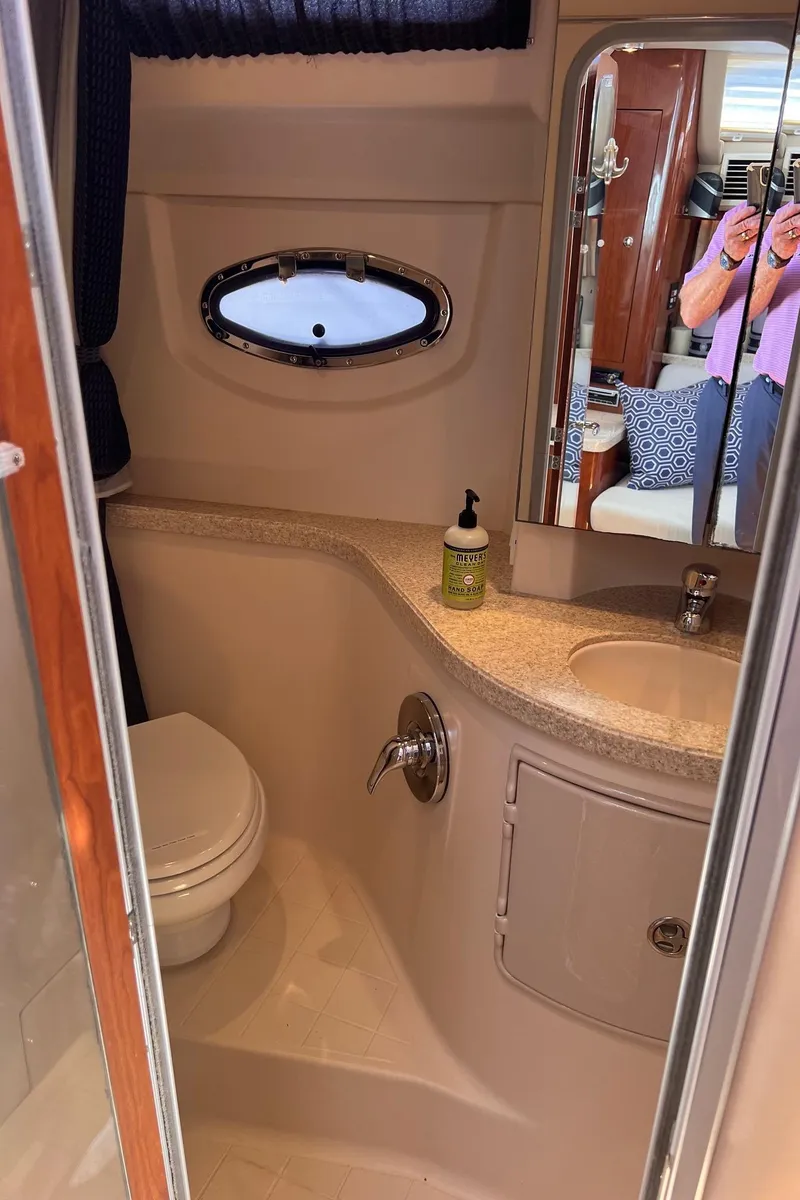 Slide: The Image of 2006 Regal 3360 Window Express bathroom with sink, toilet, and mirror. - 15