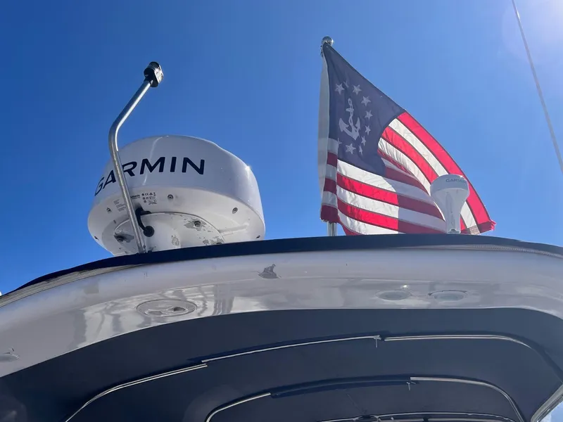Slide: The Image of 2006 Regal 3360 Window Express boat with Garmin radar and American flag. - 2