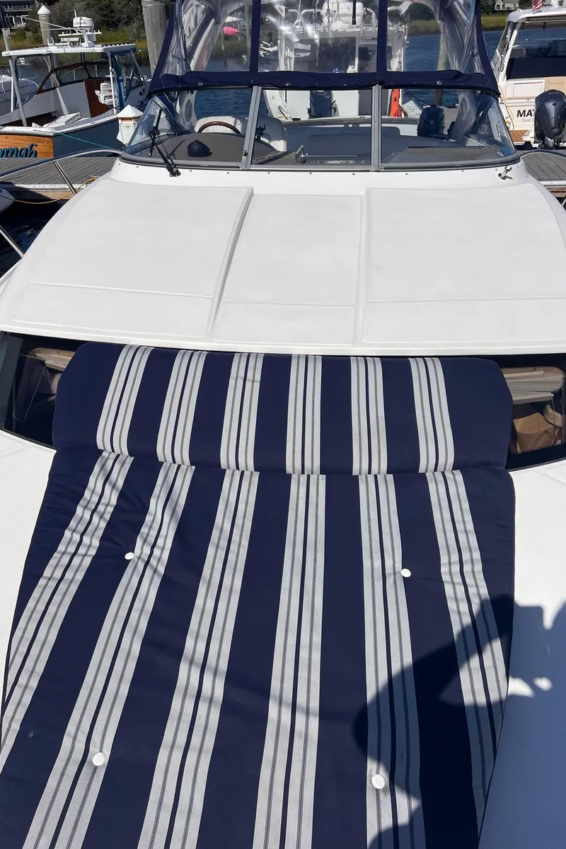 Slide: The Image of 2006 Regal 3360 Window Express boat with striped deck cushion. - 23