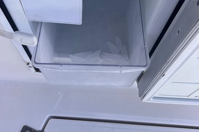 Slide: The Image of Ice maker compartment on a 2006 Regal 3360 Window Express boat. - 25