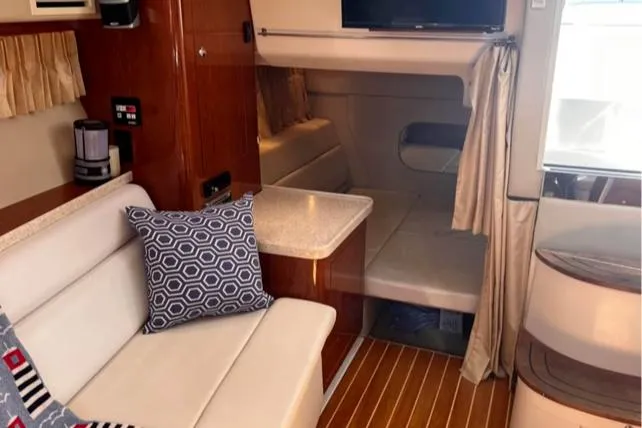 Slide: The Image of Interior of 2006 Regal 3360 Window Express yacht with cozy seating and modern decor. - 29