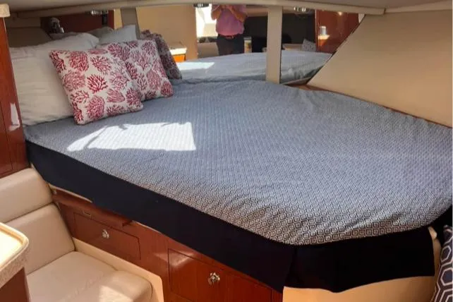 Slide: The Image of 2006 Regal 3360 Window Express cabin with bed and decorative pillows. - 30