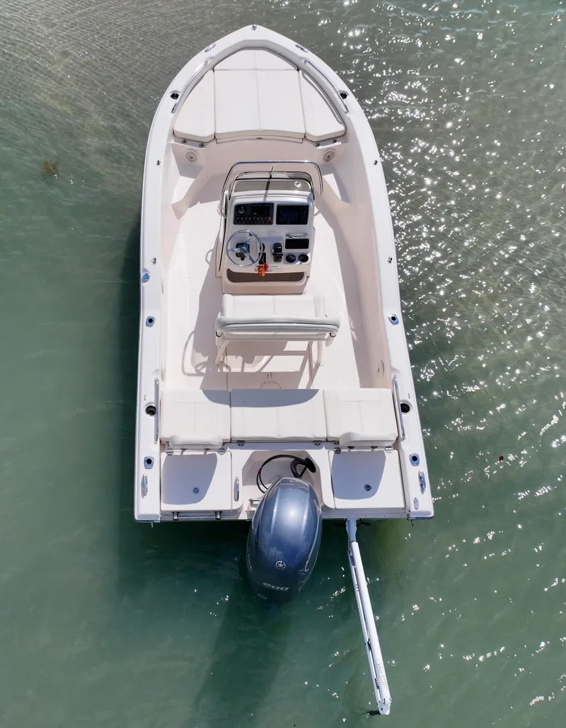 Slide: The Image of 2016 Grady-White 191 Coastal Explorer boat on clear water, aerial view. - 2