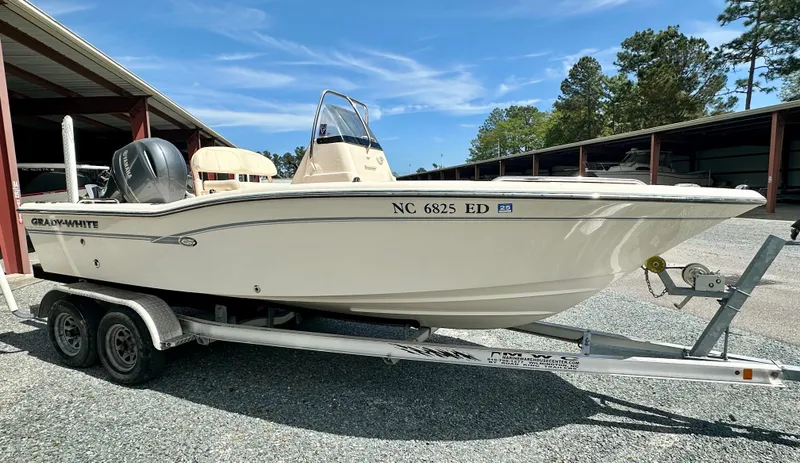 Slide: The Image of 2016 Grady-White 191 Coastal Explorer boat on trailer, parked outdoors. - 5