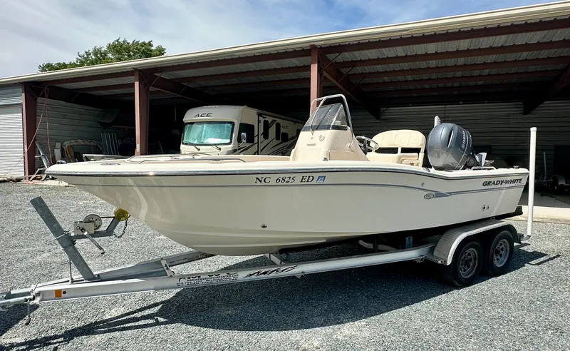 Slide: The Image of 2016 Grady-White 191 Coastal Explorer boat on trailer, parked in covered storage area. - 6