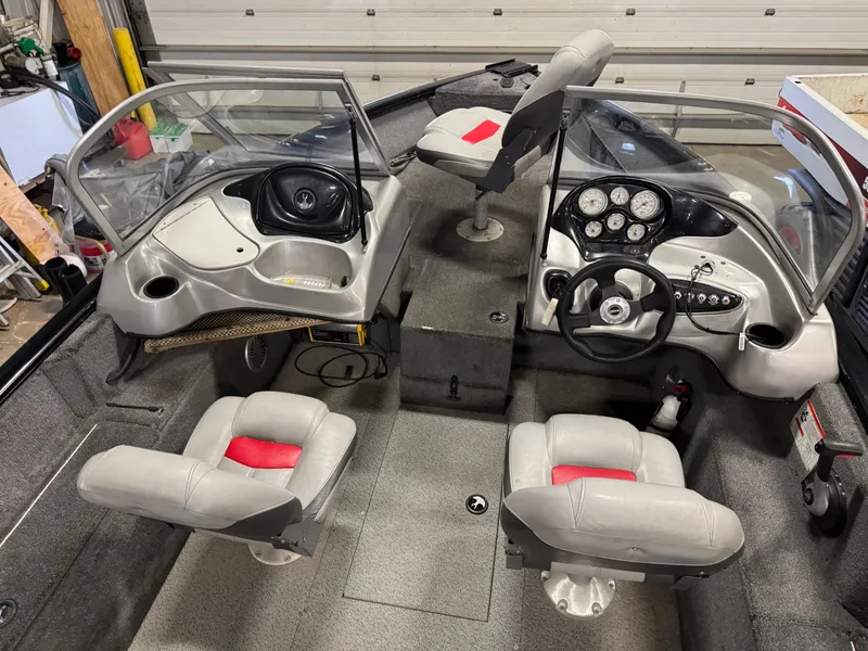 Slide: The Image of 2014 Tracker Pro Guide V-175 WT boat interior with dual consoles and seating. - 4