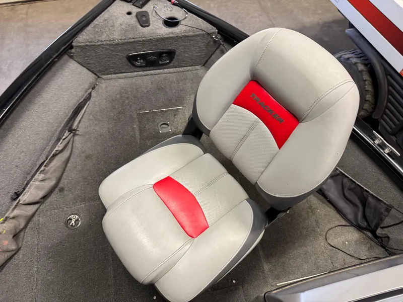Slide: The Image of 2014 Tracker Pro Guide V-175 WT boat seat with red and gray upholstery. - 6