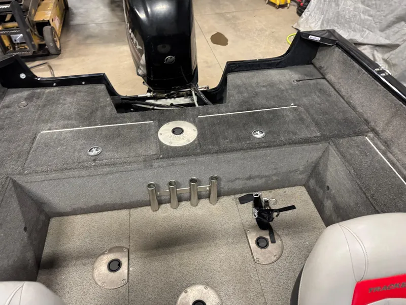 Slide: The Image of 2014 Tracker Pro Guide V-175 WT boat interior with seating and rod holders. - 9