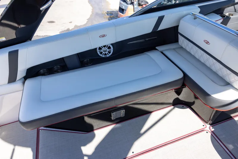 Slide: The Image of 2020 Regal 29 OBX boat interior with white seating and speaker detail. - 10