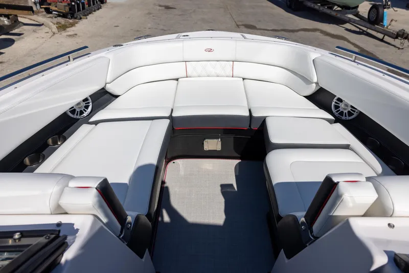 Slide: The Image of 2020 Regal 29 OBX boat interior with white seating and spacious layout. - 15