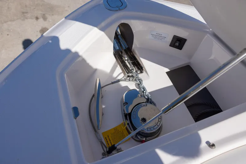 Slide: The Image of Anchor compartment of 2020 Regal 29 OBX boat, featuring a modern chain system. - 16