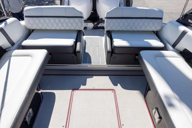 Slide: The Image of 2020 Regal 29 OBX boat interior with white cushioned seating and modern design. - 19