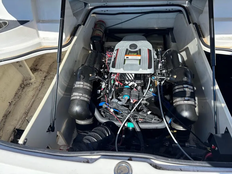Slide: The Image of Engine compartment of a 2013 Regal 2300 Bowrider boat, showcasing detailed components. - 11