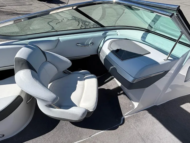 Slide: The Image of 2013 Regal 2300 Bowrider interior with sleek seating and modern dashboard design. - 16