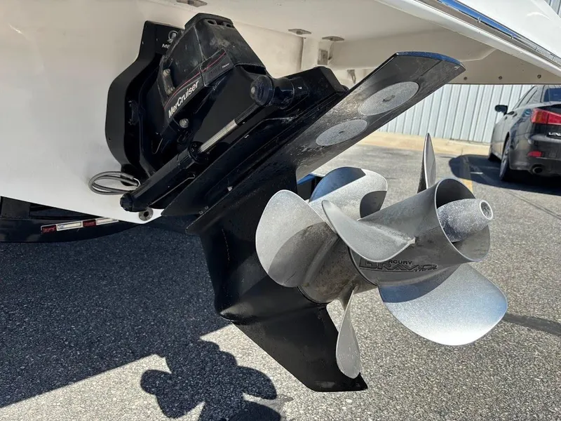 Slide: The Image of Propeller and outdrive of 2013 Regal 2300 Bowrider boat on pavement. - 4