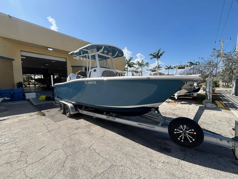 Slide: The Image of 2022 Sea Pro 239 Center Console boat on trailer, parked outdoors. - 0