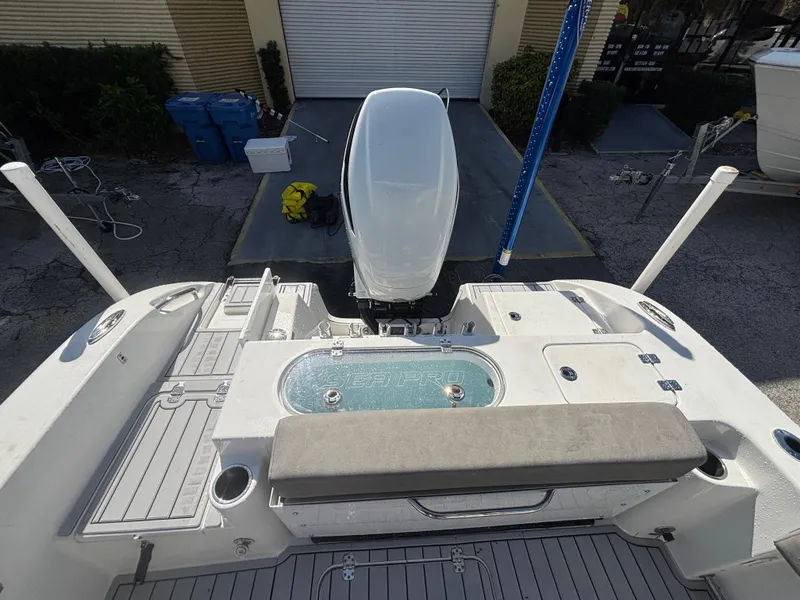 Slide: The Image of 2022 Sea Pro 239 Center Console boat with outboard motor and seating area. - 21