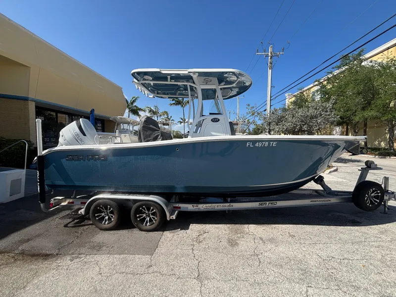 Slide: The Image of 2022 Sea Pro 239 Center Console boat on trailer, parked outdoors. - 22