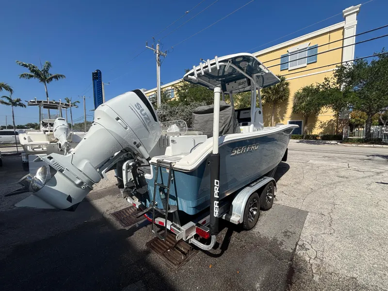 Slide: The Image of 2022 Sea Pro 239 Center Console boat on trailer, parked outdoors. - 5