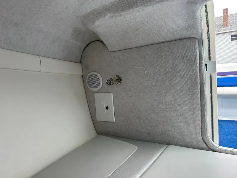 Slide: The Image of Interior of 2005 Baja 245 Performance boat, featuring speaker and control panel. - 11