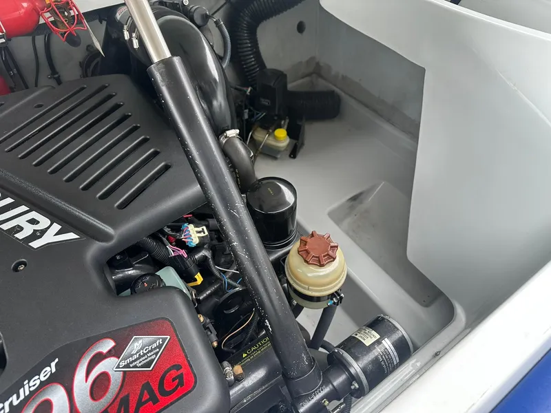 Slide: The Image of Engine compartment of a 2005 Baja 245 Performance boat, featuring a MerCruiser 496 MAG engine. - 17