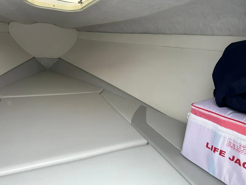 Slide: The Image of 2005 Baja 245 Performance boat interior with life jacket storage. - 9