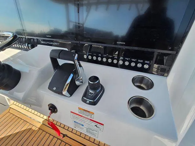 Slide: The Image of Control panel of 2025 Southport 38 FE boat with navigation screens and controls. - 26