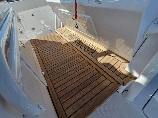 Slide: The Image of 2025 Southport 38 FE boat deck with wood finish and sleek design. - 33