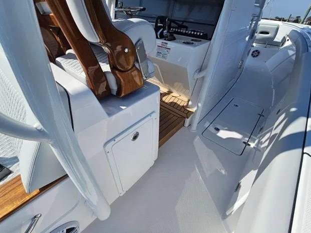 Slide: The Image of 2025 Southport 38 FE boat interior with sleek seating and modern controls. - 35
