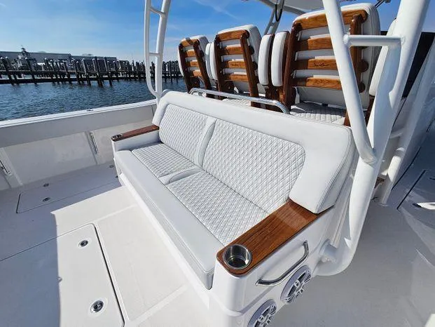 Slide: The Image of 2025 Southport 38 FE boat with luxurious seating and elegant wood accents. - 38