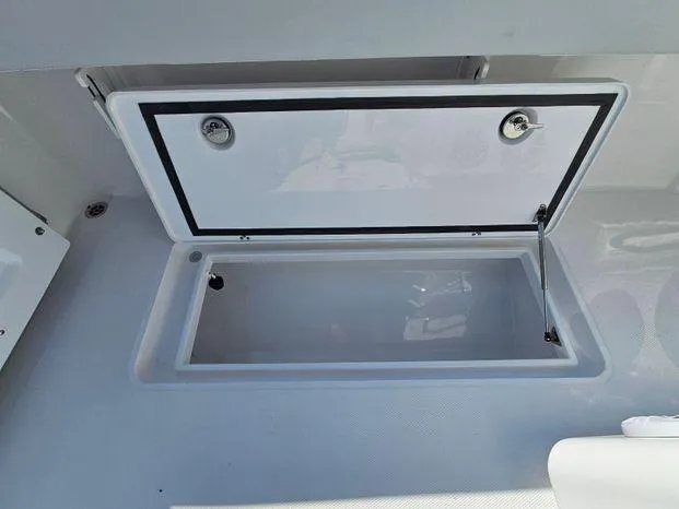 Slide: The Image of Open storage compartment on 2025 Southport 38 FE boat. - 42