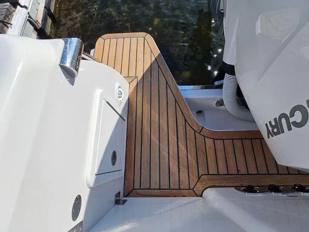 Slide: The Image of 2025 Southport 38 FE boat with teak deck and Mercury engine. - 46