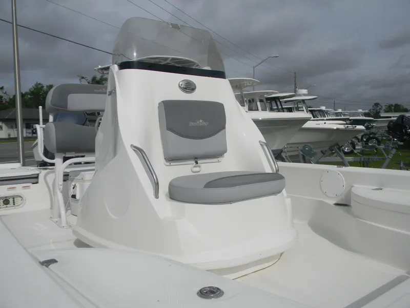 Slide: The Image of 2023 NauticStar 227 XTS boat with sleek console and seating, ideal for fishing adventures. - 3