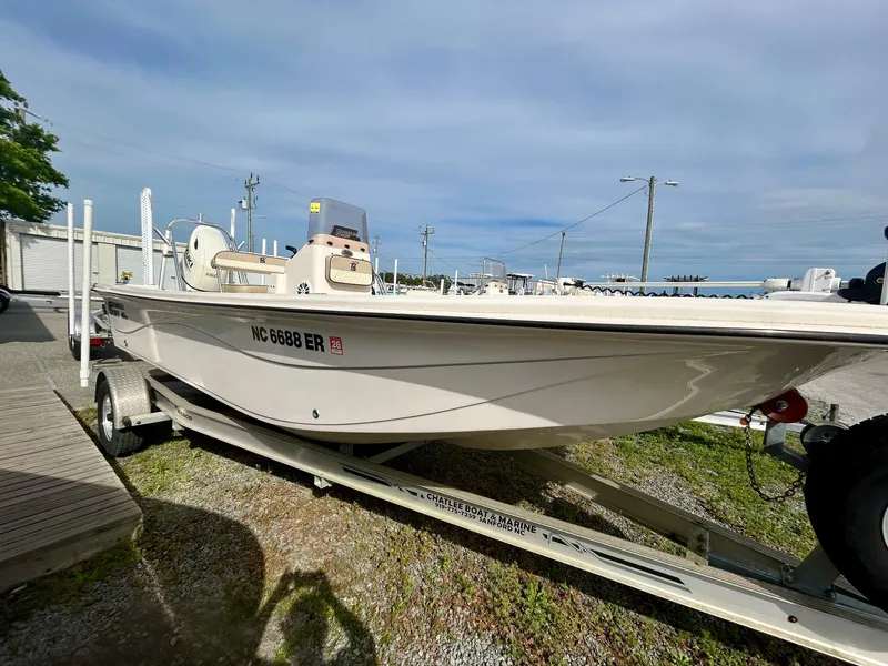 Slide: The Image of 2021 Carolina Skiff 21 LS boat on trailer, parked outdoors. - 1