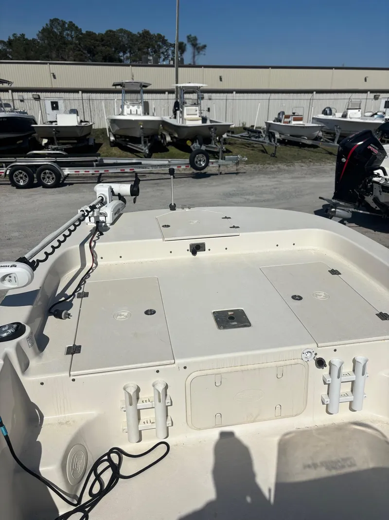Slide: The Image of 2021 Carolina Skiff 21 LS boat deck with storage compartments and trolling motor. - 5