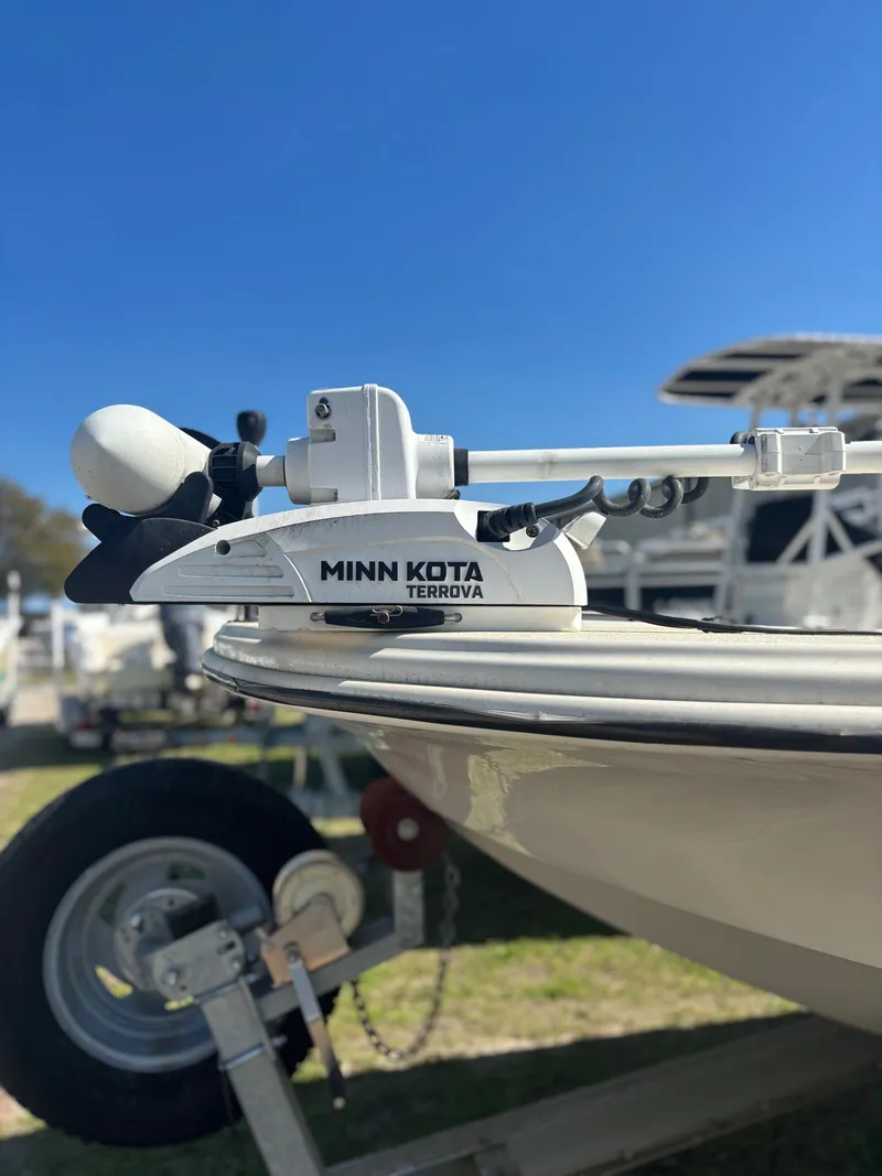 Slide: The Image of Minn Kota Terrova trolling motor on 2021 Carolina Skiff 21 LS boat, parked on trailer. - 6