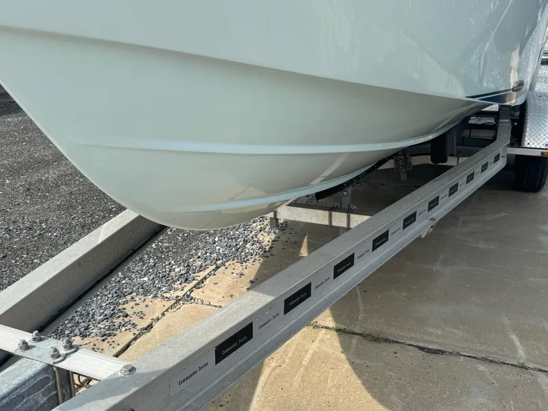 Slide: The Image of 2017 Steiger Craft 255 DV Chesapeake boat on trailer, close-up of hull and trailer details. - 11