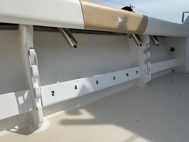 Slide: The Image of Steiger Craft 255 DV Chesapeake 2017 boat interior with rod holders and measurement guide. - 13