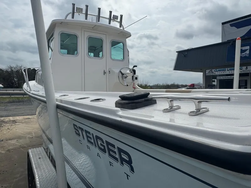 Slide: The Image of 2017 Steiger Craft 255 DV Chesapeake boat, docked, showcasing cabin and deck details. - 14