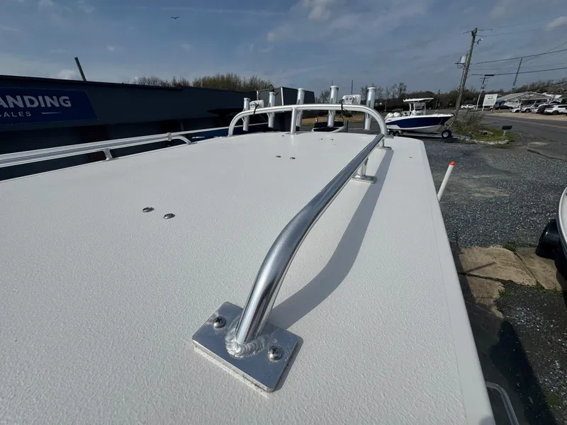 Slide: The Image of 2017 Steiger Craft 255 DV Chesapeake boat deck with railing, outdoor setting. - 23